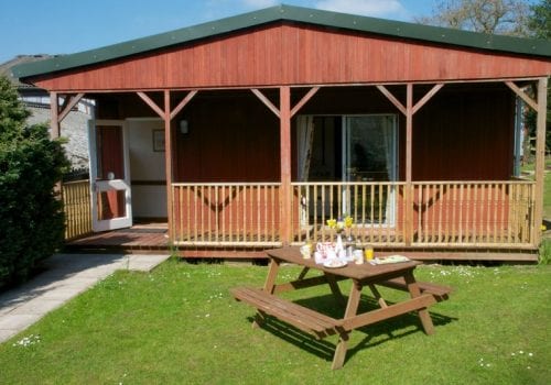 Carp Lodge with verandah and picnic bench