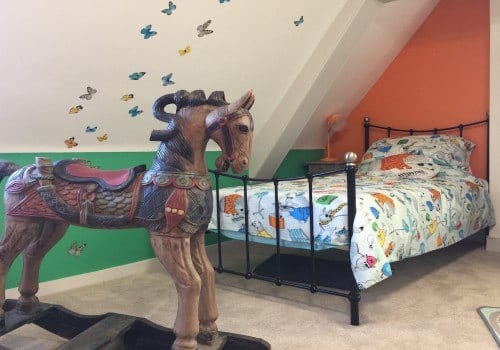 Childrens bedroom with vintage rocking horse