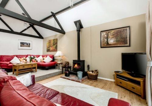 New Forest Self Catering Red Sofa Lounge area Criddlestyle Cottage