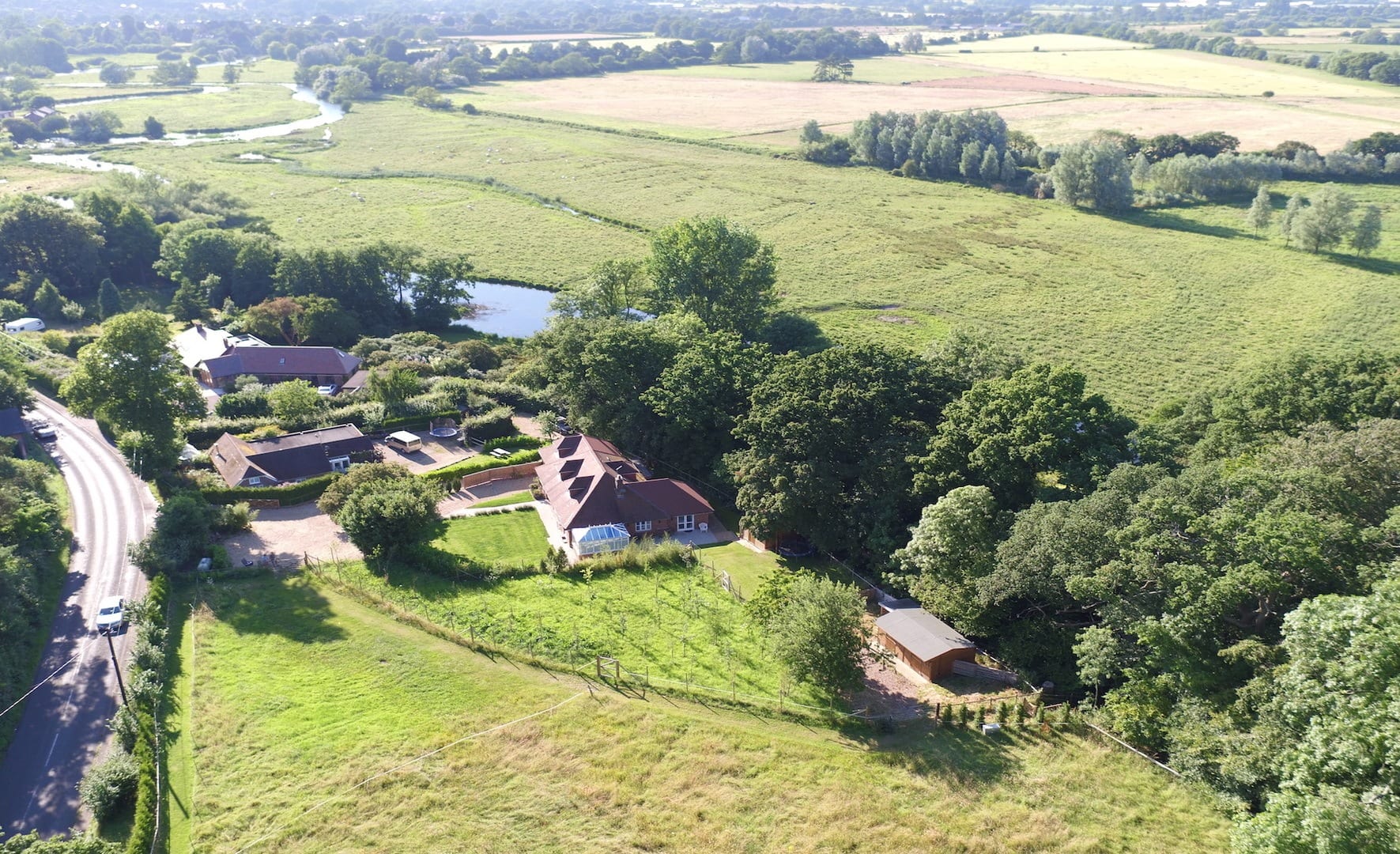 Mews Hill aerial shot showing stables and grazing