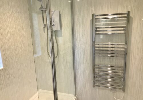 Shower with towel rail