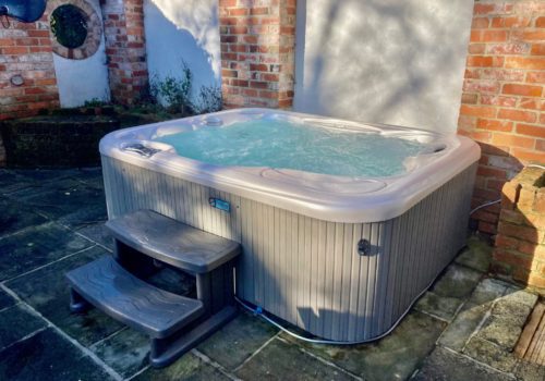 Hot tub bubbling away in self catering cottage in Dorset