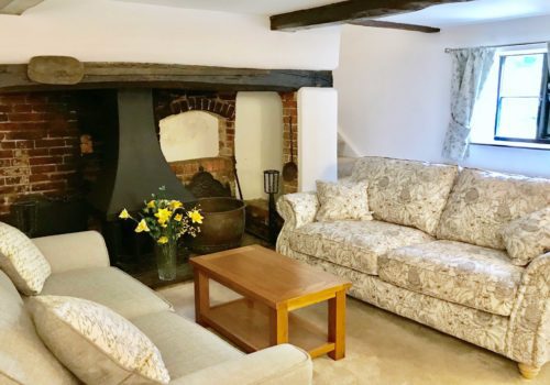 Inglenook fireplace and cosy interior in self catering lounge