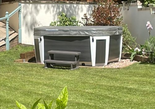 Hot tub in garden that looks very inviting