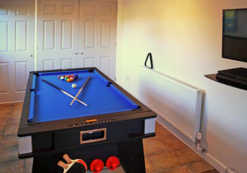 Pool table in games room in New Forest self catering house