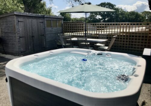 Hot tub bubbling away in this self catering New Forest Holiday Let Arniss