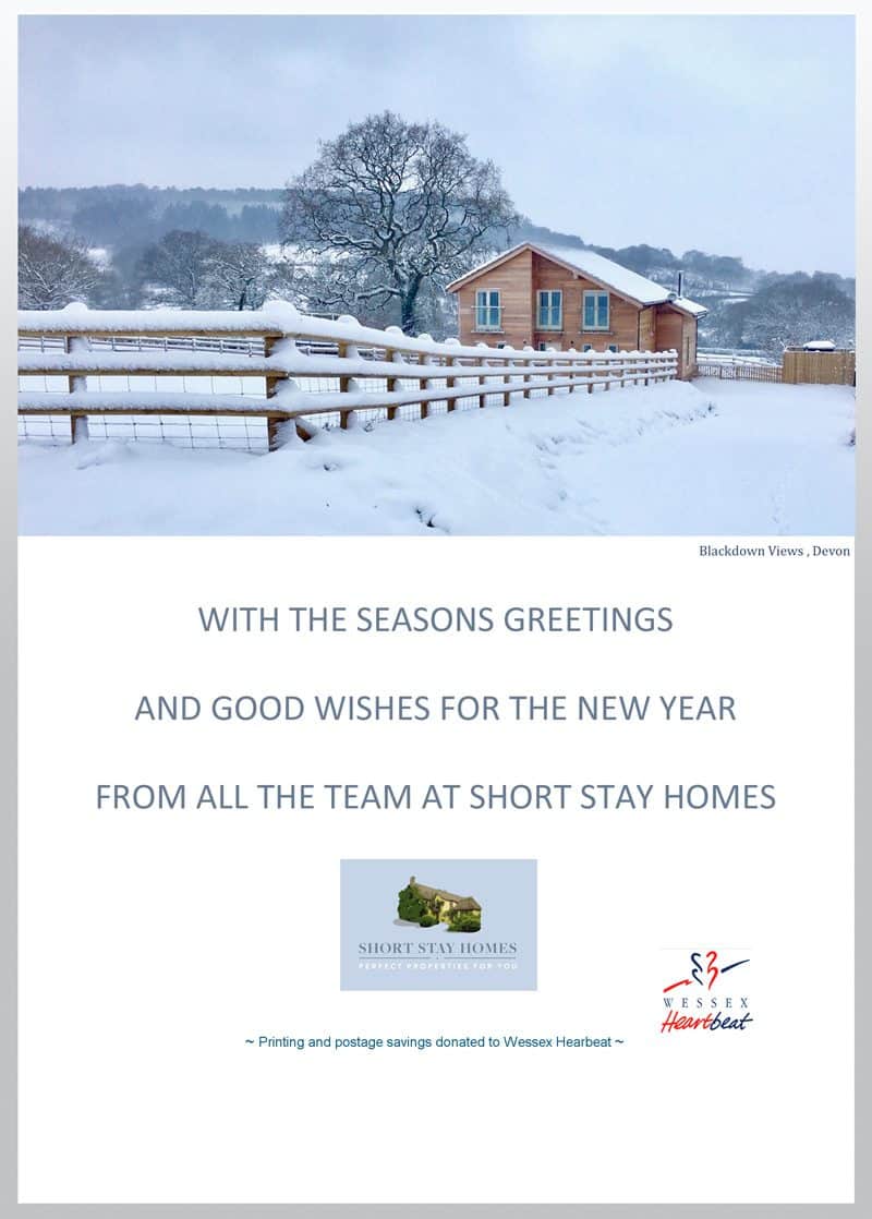 Card showing a beautiful snowy chalet