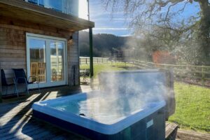 Hot tub with steam in the crisp air at Blackdown Views Devon.