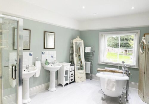 Twin sinks, double shower and roll top bath tub in Gold award Dorset Property