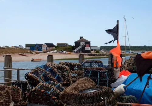 mudeford-4891785697_9c473ed510_o Fishing boats and nets with views of the beach huts